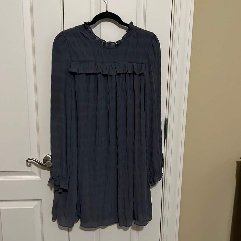 Cute flowing long sleeve doll baby dress.